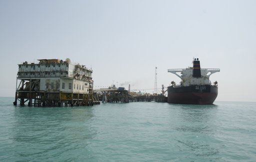  A crane  –  vessels are seen at the Al-Basra terminal in southern Iraq.