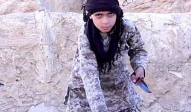  ISIS trains boys on the beheadings using dolls