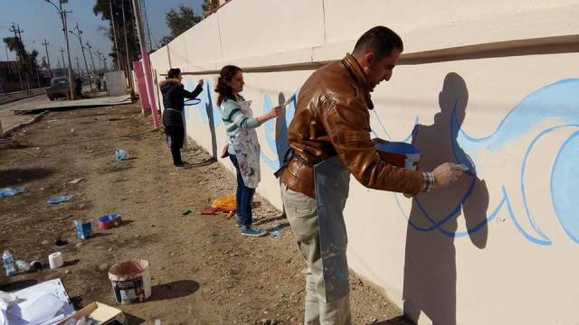  Photos: Mosul activists replace Islamic State graffiti with delightful murals