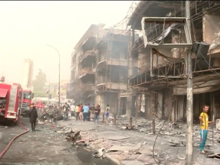  Scores of people begin demonstrations at the Karrada bombing site