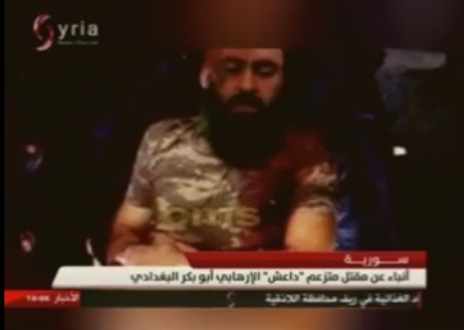 Screen grab from Syrian State TV news broadcast claiming ISIS leader Abu Bakr al-Baghdadi killed. The image of al-Baghdadi was previous debunked as a hoax.