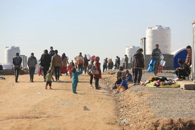  Smuggled by boat or scaling wrecked bridges, residents escape Mosul’s besieged west