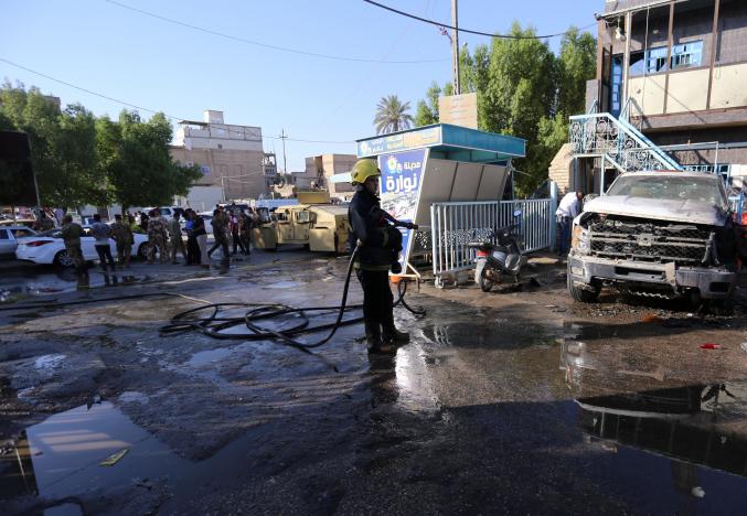  Woman detonates bomb in crowded Friday market in Iraq, killing at least 30