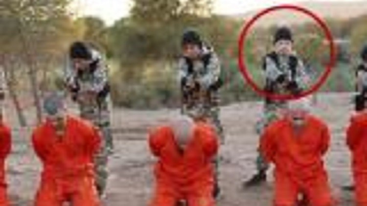 The child executioner second from the right is believed to be JoJo, a boy whose mother brought him to Syria three years ago when he was 10-years-old.