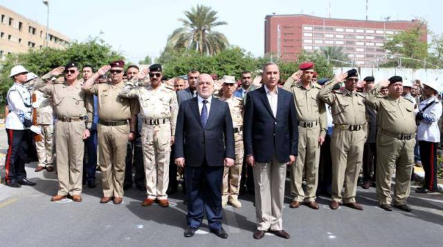  Exclusive photos: Abadi, DM in martyr Brigadier General Hassan al-Fatlawi’s funeral