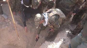  Forces run into a third mass grave of security members near Hawija