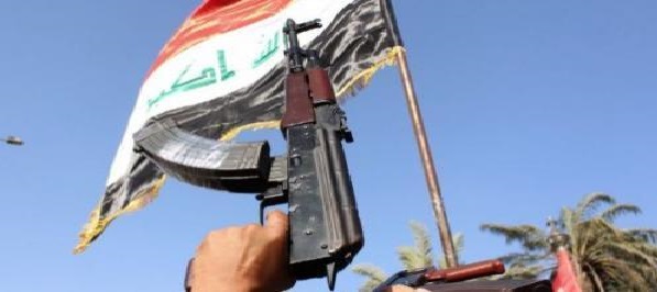  Security forces raise Iraqi flag in Tel Abu Jarad area south of Baiji refinery