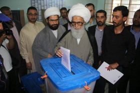 Religious Authority, Basheer al-Najafi, casts his vote in Najaf