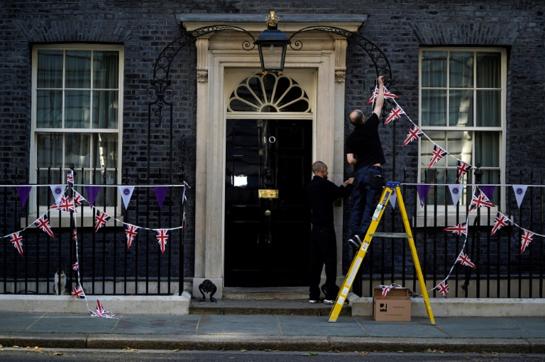  UK’s wounded Johnson presses on despite Tory rebellion