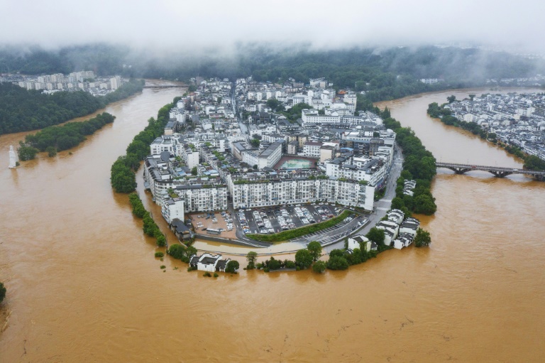  Hundreds of thousands evacuated in China after heaviest rains in decades