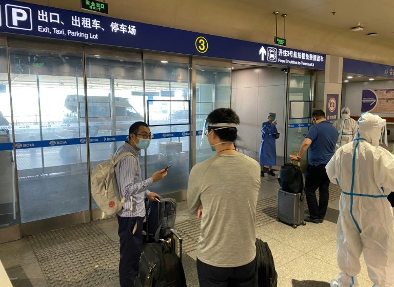  China halves quarantine time for overseas travellers