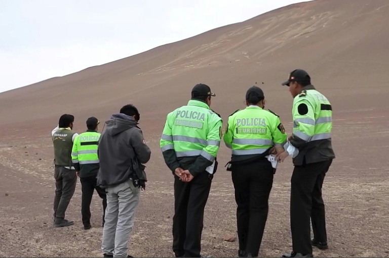  Tourists trample all over protected, prehistoric Peruvian hill carving