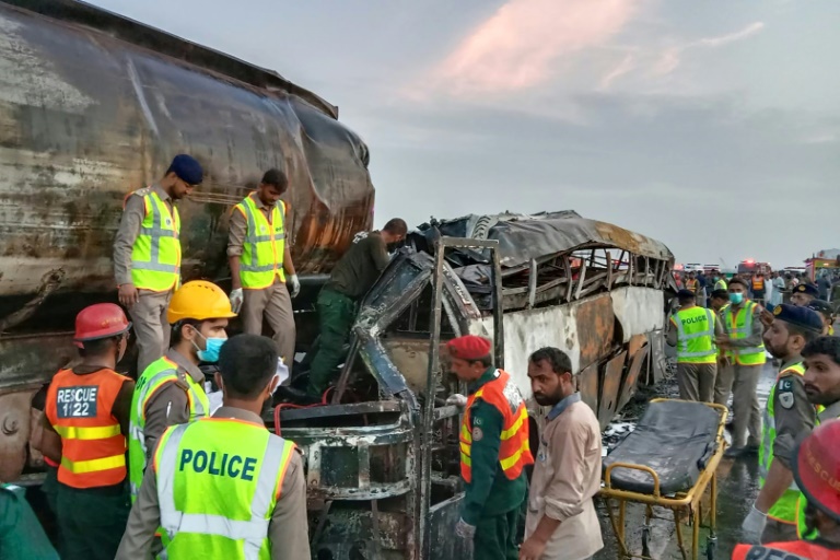  Pakistan road crash inferno kills 20