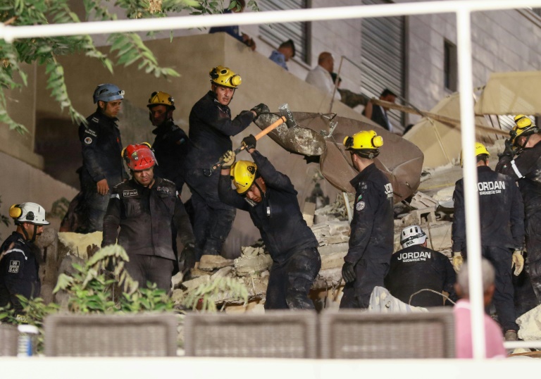  Jordan rescuers search for 10 missing under collapsed building