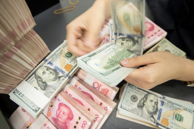  China’s offshore yuan hits record low against dollar