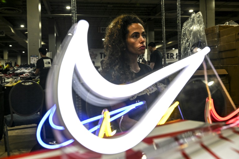  Nike shares tumble as it reports lower profits