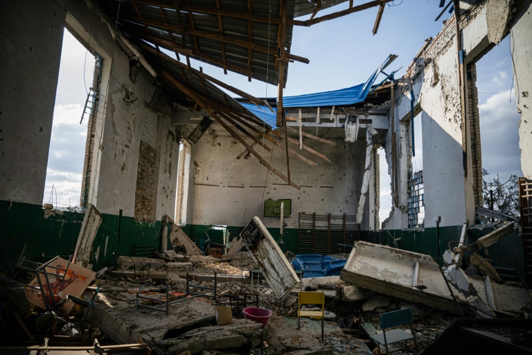  Rubble and relief in recaptured south Ukraine village