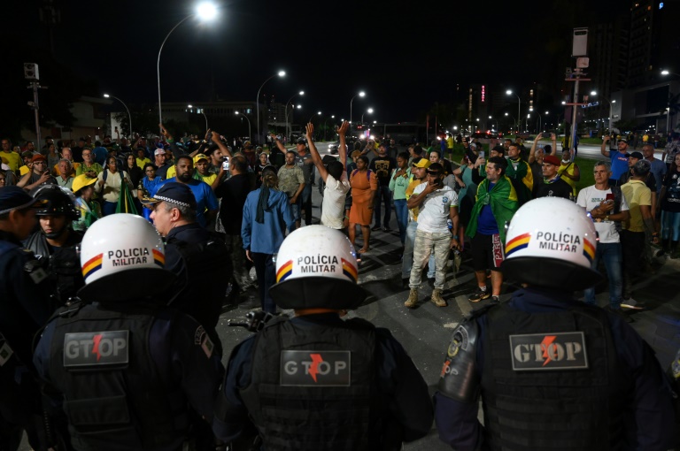  Bolsonaro supporters clash with police, set fires in Brasilia