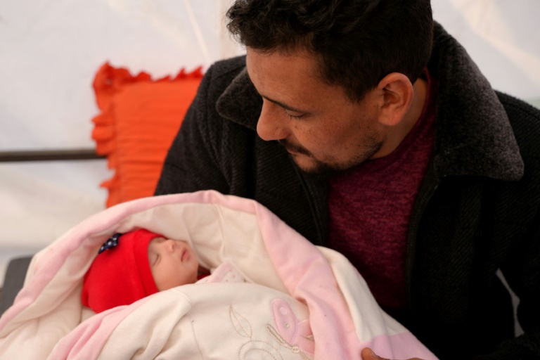  Syria family takes in baby born under quake rubble