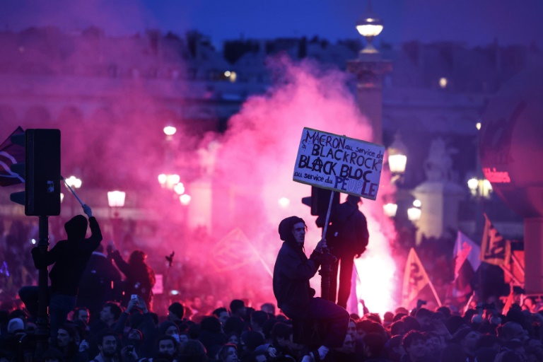  French roads blocked, refineries on strike after Macron pension move