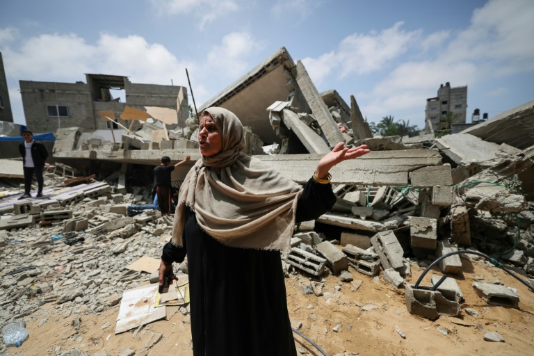  Gazans amid the rubble of homes flattened by fighting