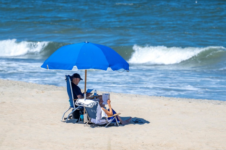  As Trump faces indictment heat, Biden chills beachside