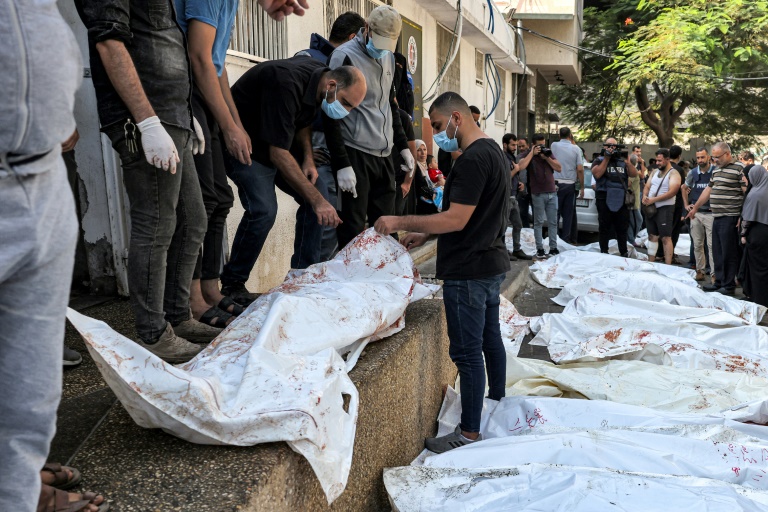  Mass graves, ice-cream truck mortuary as bodies pile up in Gaza