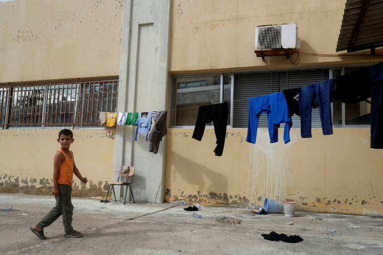  Fleeing Israel strikes, south Lebanon families move into schools