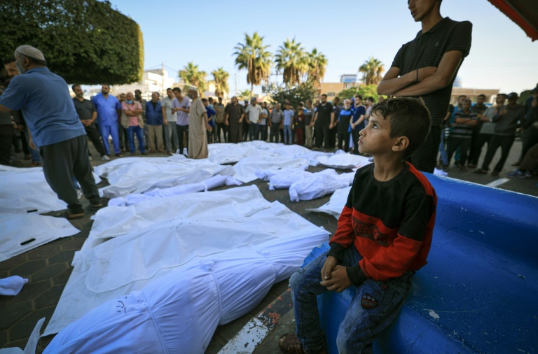  Gazans bury their dead in orchards and football fields