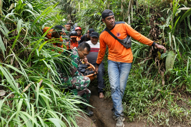  Indonesian rescuers race to find 12 missing after eruption