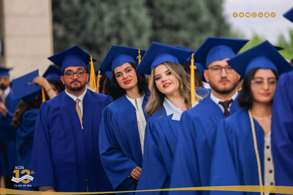 A group of AUIS students wearing graduation outfits during their graduation cermoney